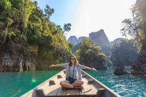 woman in boat on scenic river to celebrate world photography day