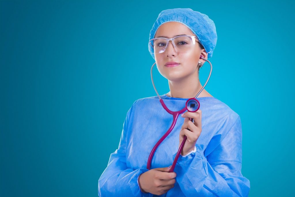 Healthcare worker holding stethoscope